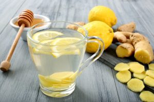 Honey and lemon water in a glass mug