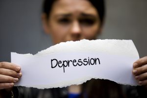 A woman with a depression sign