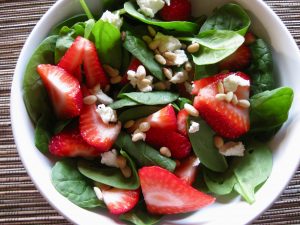 Colorful strawberry and spinach salad
