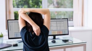desk-chair-woman-stretches