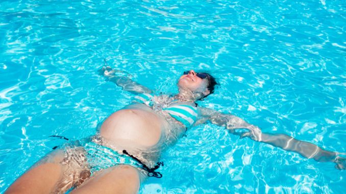 pregnant woman swimming Pregnancy Workout Plan