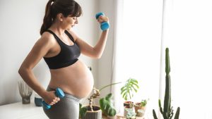 pregnant woman training arms