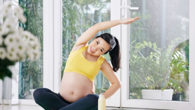 woman lotus position Pregnancy Workout Plan