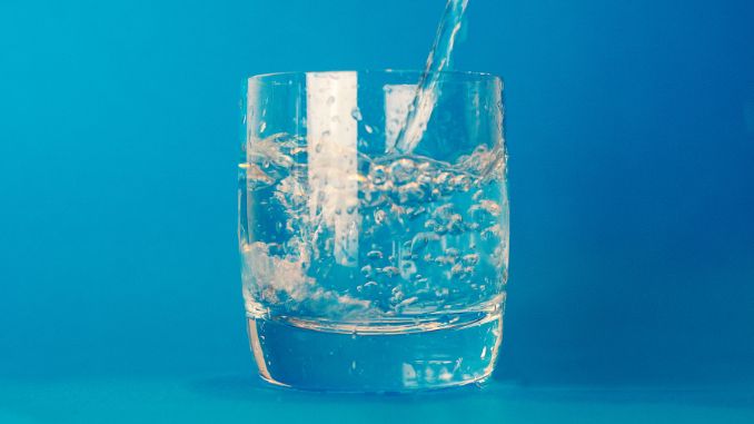 clear drinking glass of water - How to get caffeine out of your system